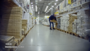 Employee Picking up flooring